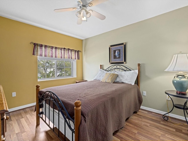 8222 Haven Harbour Way, Bradenton, FL 34212 - bedroom with baseboards, wood finished floors, and ceiling fan
