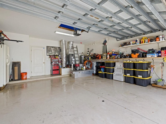 8222 Haven Harbour Way, Bradenton, FL 34212 - garage with a garage door opener, a workshop area, and white fridge with ice dispenser