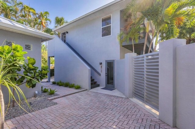 4505 Camino Real, Sarasota, FL 34231 - view of home's exterior with stucco siding and stairway