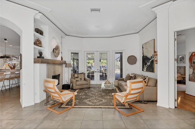 4505 Camino Real, Sarasota, FL 34231 - living area featuring tile patterned floors, french doors, and a fireplace