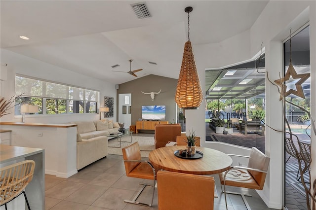 4505 Camino Real, Sarasota, FL 34231 - dining room with light tile patterned flooring, plenty of natural light, lofted ceiling, and a ceiling fan