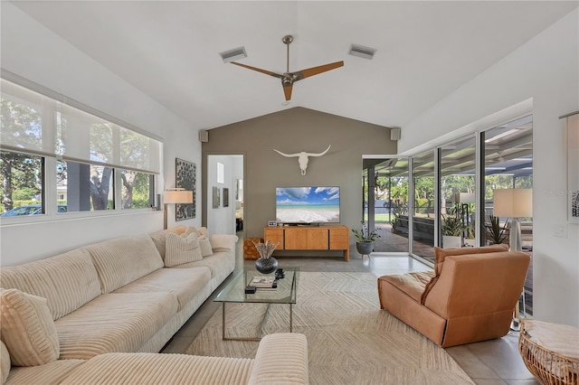 4505 Camino Real, Sarasota, FL 34231 - tiled living area with a ceiling fan and vaulted ceiling