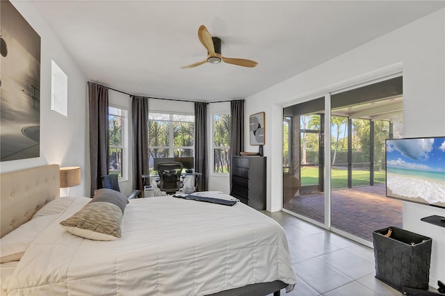 4505 Camino Real, Sarasota, FL 34231 - bedroom featuring access to exterior, light tile patterned floors, and a ceiling fan