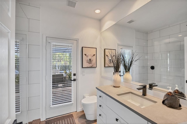 4505 Camino Real, Sarasota, FL 34231 - bathroom featuring toilet and vanity