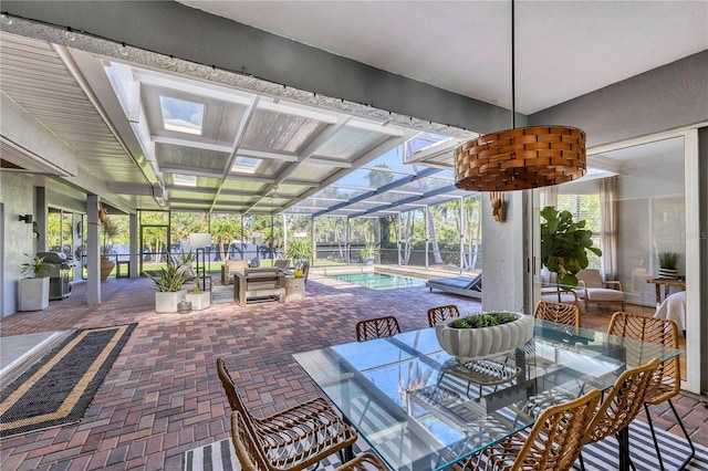 4505 Camino Real, Sarasota, FL 34231 - fenced backyard featuring outdoor dining space, a patio area, an outdoor pool, and glass enclosure