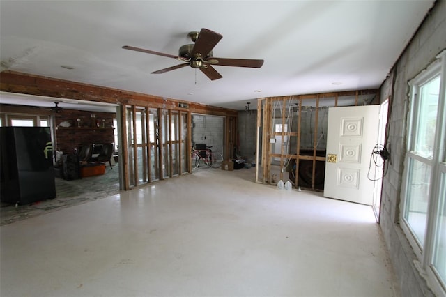 129 Pierson Ln, Sarasota, FL 34242 - unfurnished living room featuring concrete floors and a ceiling fan