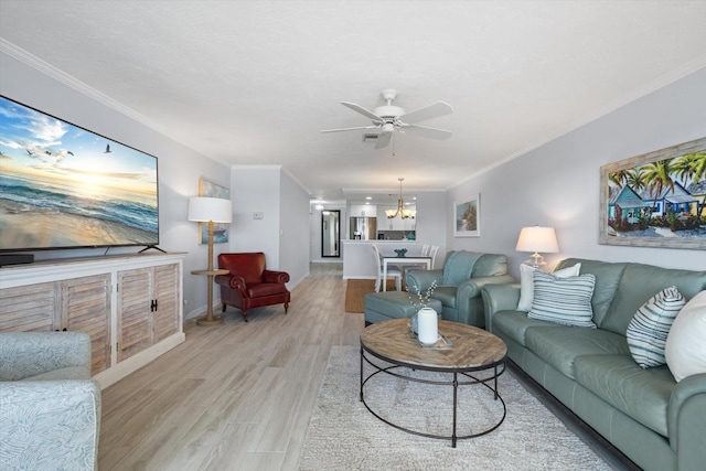 1255 E Peppertree Dr Unit 507, Sarasota, FL 34242 - living room with a chandelier, a ceiling fan, light wood-style flooring, crown molding, and baseboards