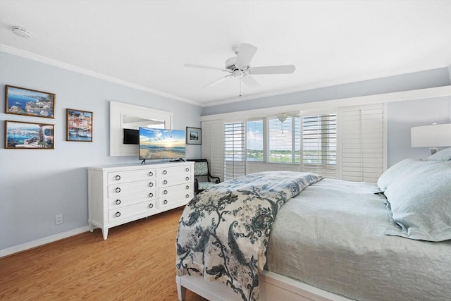 1255 E Peppertree Dr Unit 507, Sarasota, FL 34242 - bedroom with ornamental molding, baseboards, light wood finished floors, and ceiling fan