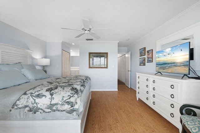 1255 E Peppertree Dr Unit 507, Sarasota, FL 34242 - bedroom with light wood-style floors, crown molding, baseboards, and a ceiling fan