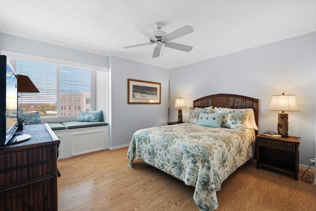 1255 E Peppertree Dr Unit 507, Sarasota, FL 34242 - bedroom with light wood-type flooring, baseboards, and ceiling fan