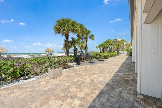 1255 E Peppertree Dr Unit 507, Sarasota, FL 34242 - view of patio / terrace with view of water and beach