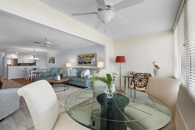 1255 E Peppertree Dr Unit 507, Sarasota, FL 34242 - dining space with healthy amount of natural light, ceiling fan, and a chandelier