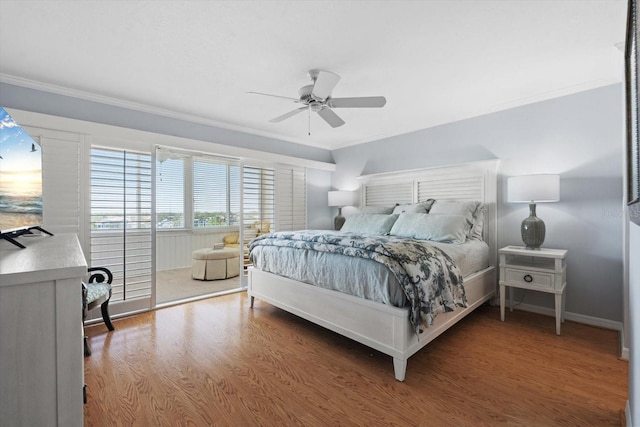 1255 E Peppertree Dr Unit 507, Sarasota, FL 34242 - bedroom with ornamental molding, wood finished floors, baseboards, and a ceiling fan