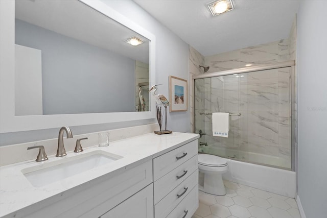 1255 E Peppertree Dr Unit 507, Sarasota, FL 34242 - bathroom featuring combined bath / shower with glass door, vanity, toilet, and tile patterned flooring