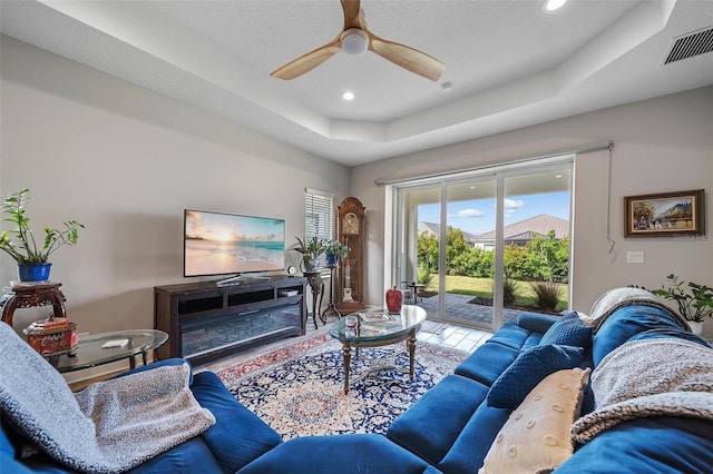 2625 Star Apple Way, Sarasota, FL 34240 - living room featuring a tray ceiling, ceiling fan, and recessed lighting