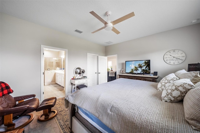 2625 Star Apple Way, Sarasota, FL 34240 - bedroom with ensuite bathroom, a ceiling fan, and light tile patterned floors
