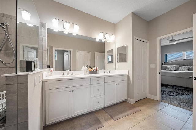 2625 Star Apple Way, Sarasota, FL 34240 - full bathroom featuring double vanity, tile patterned floors, connected bathroom, and baseboards
