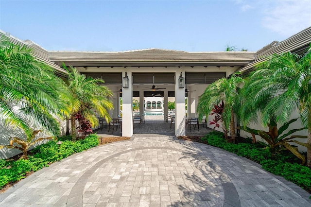 2625 Star Apple Way, Sarasota, FL 34240 - view of patio / terrace featuring ceiling fan and an outdoor pool
