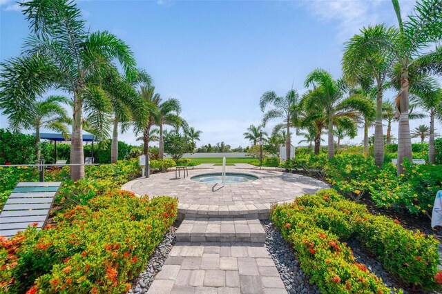 2625 Star Apple Way, Sarasota, FL 34240 - view of community featuring a hot tub and a patio