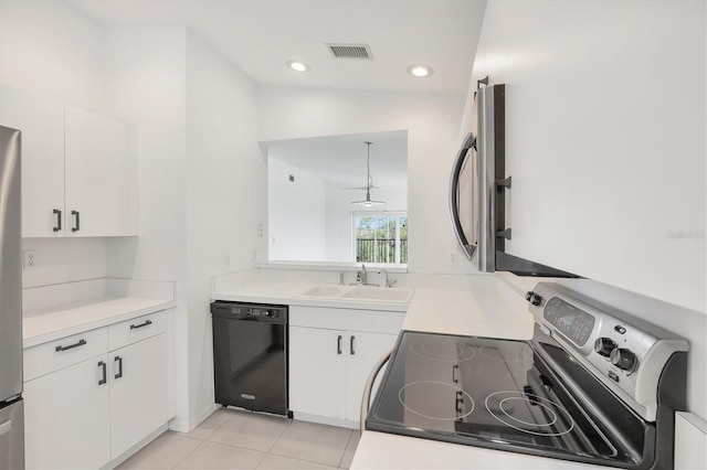 9630 Club S Cir Unit 6303, Sarasota, FL 34238 - kitchen with appliances with stainless steel finishes, a sink, white cabinetry, light countertops, and recessed lighting