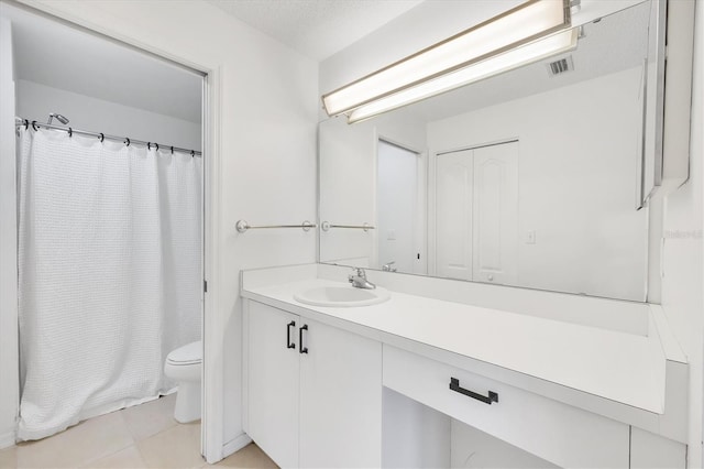 9630 Club S Cir Unit 6303, Sarasota, FL 34238 - bathroom with toilet, vanity, tile patterned floors, and a shower with shower curtain