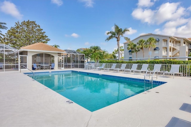 9630 Club S Cir Unit 6303, Sarasota, FL 34238 - community pool featuring a patio and glass enclosure