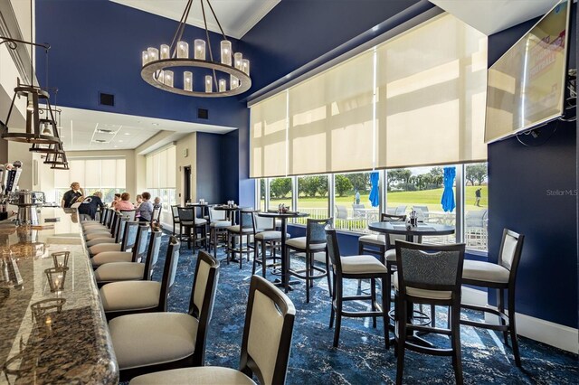 9630 Club S Cir Unit 6303, Sarasota, FL 34238 - dining area featuring a high ceiling and a chandelier