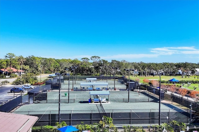 9630 Club S Cir Unit 6303, Sarasota, FL 34238 - view of tennis court featuring view of wooded area