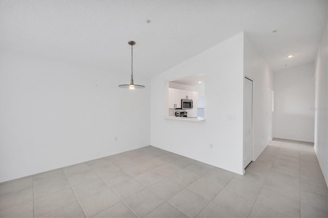 9630 Club S Cir Unit 6303, Sarasota, FL 34238 - unfurnished living room with lofted ceiling and light tile patterned flooring