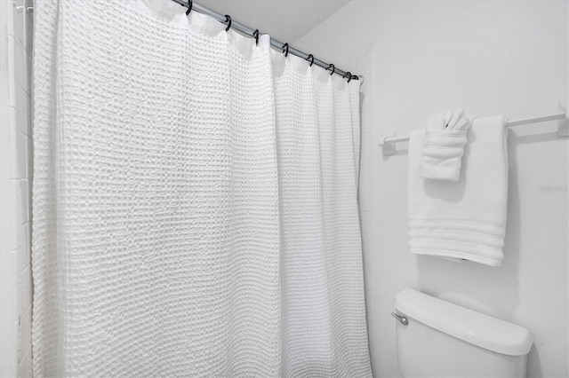 9630 Club S Cir Unit 6303, Sarasota, FL 34238 - bathroom featuring toilet and a shower with shower curtain