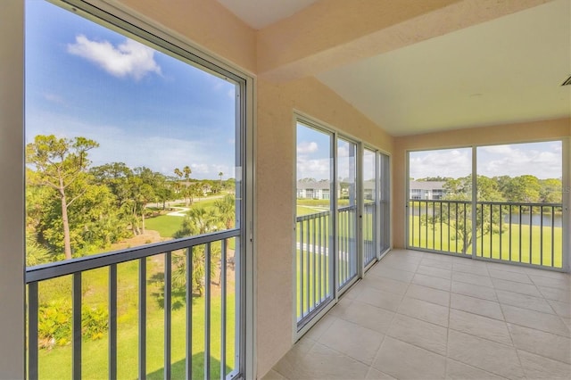 9630 Club S Cir Unit 6303, Sarasota, FL 34238 - unfurnished sunroom with tile patterned flooring and lofted ceiling