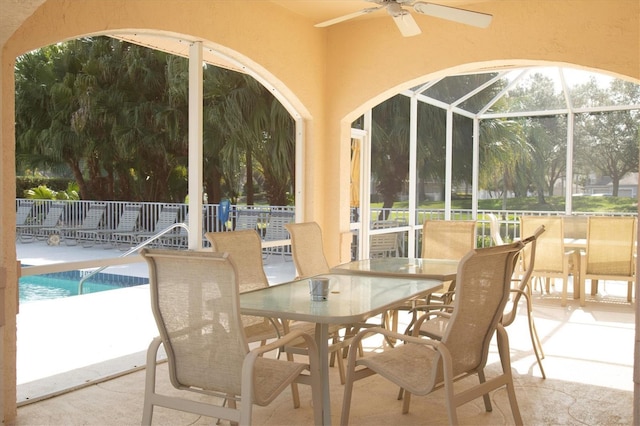 9630 Club S Cir Unit 6303, Sarasota, FL 34238 - sunroom featuring ceiling fan and outdoor dining area