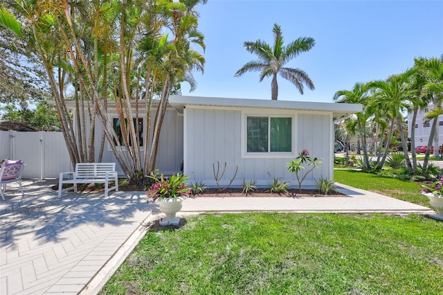 643 Calle Del Otono, Sarasota, FL 34242 - view of front of home featuring board and batten siding and a patio