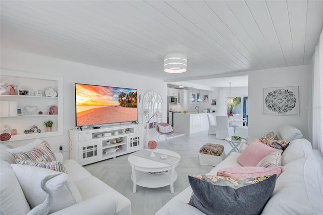 643 Calle Del Otono, Sarasota, FL 34242 - living room with built in features and wood ceiling