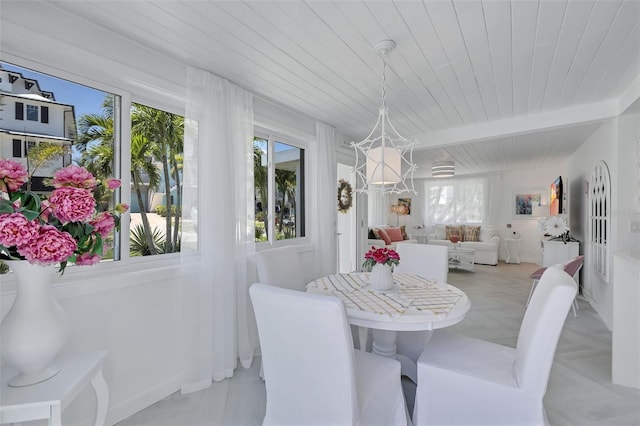 643 Calle Del Otono, Sarasota, FL 34242 - dining area featuring wood ceiling with exposed beams and a chandelier