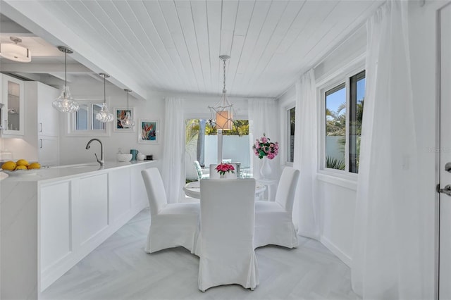 643 Calle Del Otono, Sarasota, FL 34242 - dining room featuring wood ceiling and a chandelier