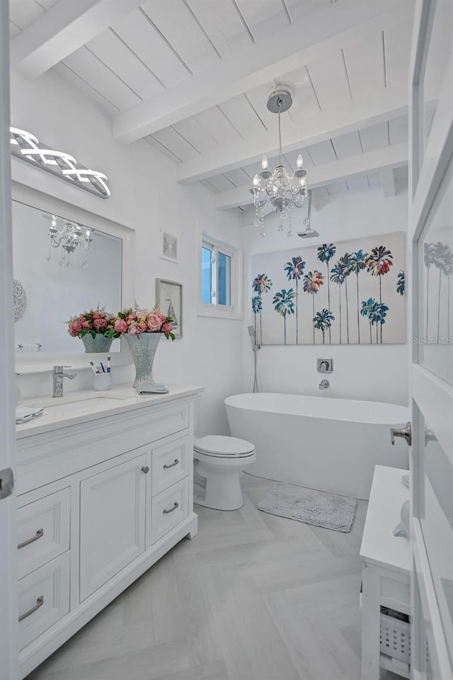 643 Calle Del Otono, Sarasota, FL 34242 - bathroom with a chandelier, a soaking tub, vanity, toilet, and wooden ceiling with exposed beams