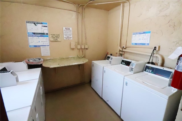 shared laundry with washing machine and clothes dryer