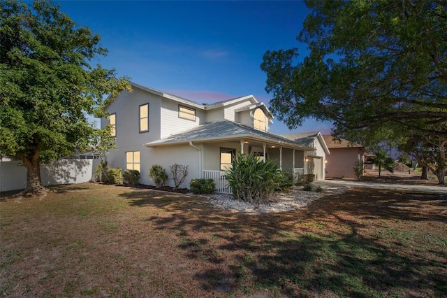 5310 SW 25th Ct, Cape Coral, FL 33914 - traditional home with a porch and an attached garage