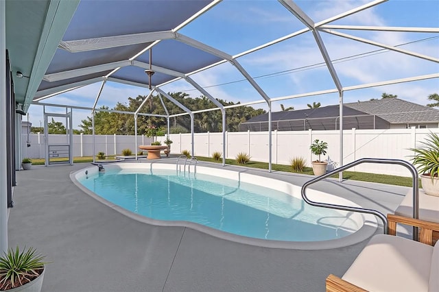 5310 SW 25th Ct, Cape Coral, FL 33914 - view of swimming pool featuring a fenced backyard, a patio, and glass enclosure