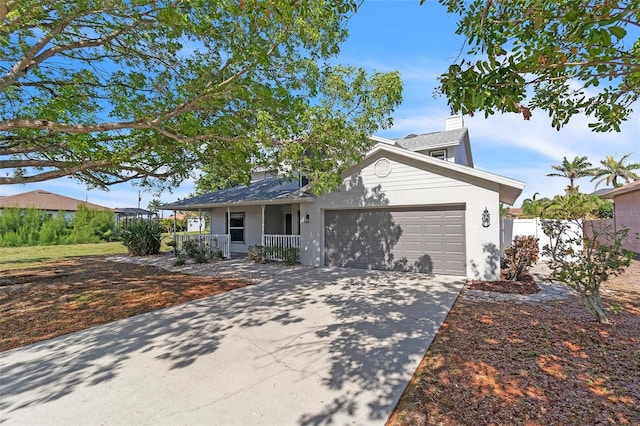 5310 SW 25th Ct, Cape Coral, FL 33914 - view of front facade featuring covered porch, a garage, concrete driveway, a chimney, and stucco siding