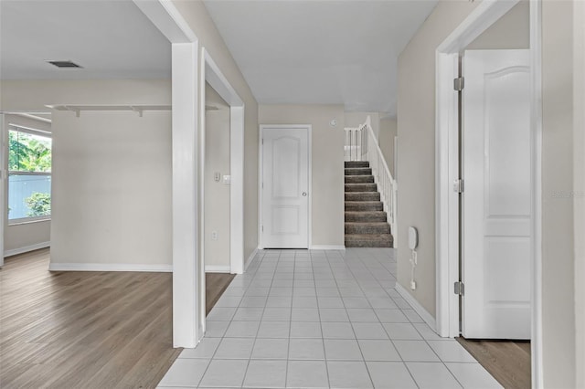 5310 SW 25th Ct, Cape Coral, FL 33914 - hall with stairway, baseboards, and light wood-style floors