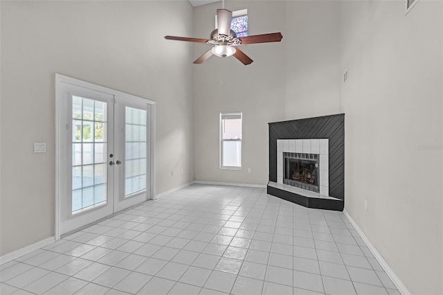 5310 SW 25th Ct, Cape Coral, FL 33914 - unfurnished living room featuring a high ceiling, ceiling fan, plenty of natural light, french doors, and light tile patterned floors