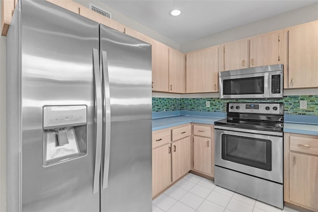 5310 SW 25th Ct, Cape Coral, FL 33914 - kitchen with appliances with stainless steel finishes, light brown cabinets, decorative backsplash, and recessed lighting