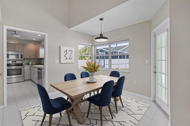 5310 SW 25th Ct, Cape Coral, FL 33914 - dining room with light tile patterned flooring, baseboards, and a ceiling fan