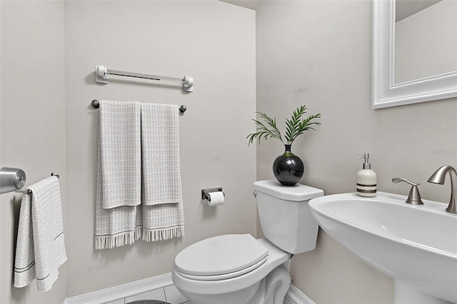 5310 SW 25th Ct, Cape Coral, FL 33914 - half bath featuring toilet, a sink, and baseboards