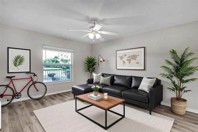 5310 SW 25th Ct, Cape Coral, FL 33914 - living room featuring wood finished floors, baseboards, and a ceiling fan