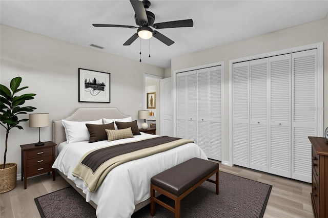 5310 SW 25th Ct, Cape Coral, FL 33914 - bedroom with multiple closets, light wood-style floors, and ceiling fan