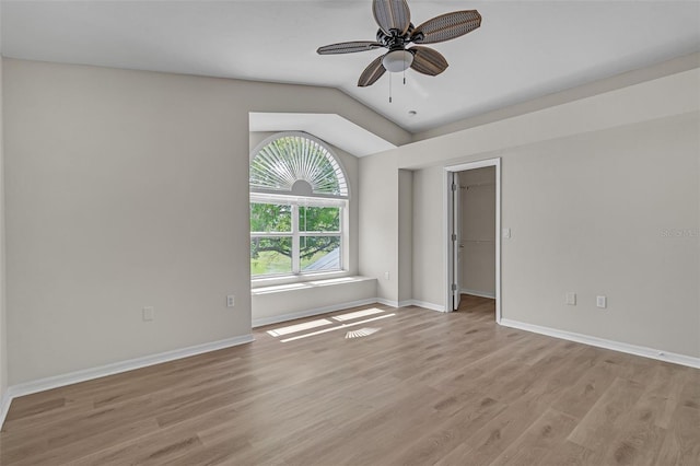 5310 SW 25th Ct, Cape Coral, FL 33914 - empty room with light wood-type flooring, ceiling fan, baseboards, and lofted ceiling