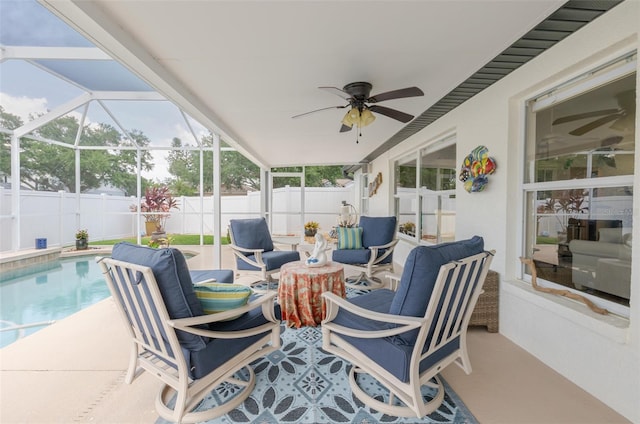 11021 4th Ave E, Bradenton, FL 34212 - fenced backyard featuring a patio, an outdoor hangout area, ceiling fan, and glass enclosure